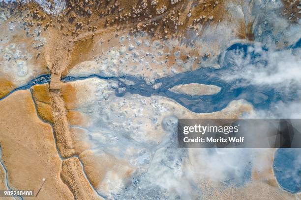 aerial view, small bridge over steaming river and fumaroles, geothermal area hveraroend, also hverir or namaskard, north iceland, iceland - nordurland eystra imagens e fotografias de stock