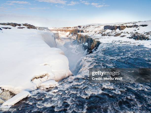 aerial view, snowy landscape, gorge, canyon with falling water masses, dettifoss waterfall in winter, northern iceland, iceland - dettifoss waterfall foto e immagini stock