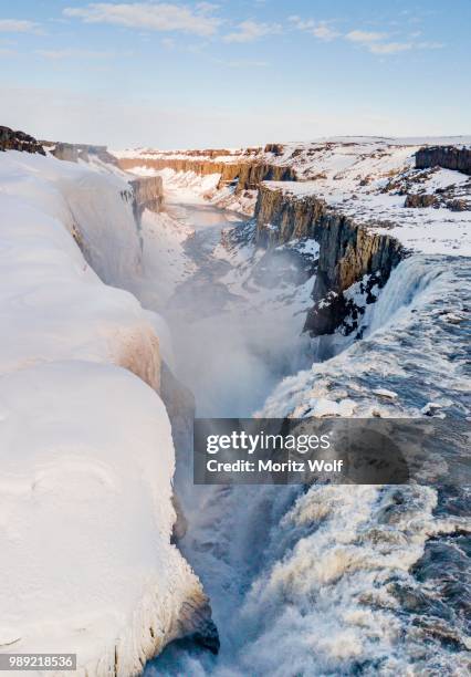 aerial view, snowy landscape, gorge, canyon with falling water masses, dettifoss waterfall in winter, northern iceland, iceland - dettifoss waterfall stock pictures, royalty-free photos & images