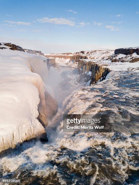 aerial view, snowy landscape, gorge, canyon with falling water masses, dettifoss waterfall in winter, northern iceland, iceland - dettifoss stockfoto's en -beelden