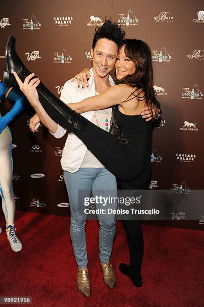 Johnny Weir and Robin Antin arrive at Vegas Uncorked premiere grand tasting event at Caesars Palace on May 7, 2010 in Las Vegas, Nevada.