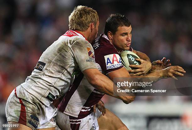 Anthony Watmough of the Sea Eagles is tackled during the round nine NRL match between the Manly Sea Eagles and the St George Illawarra Dragons at...