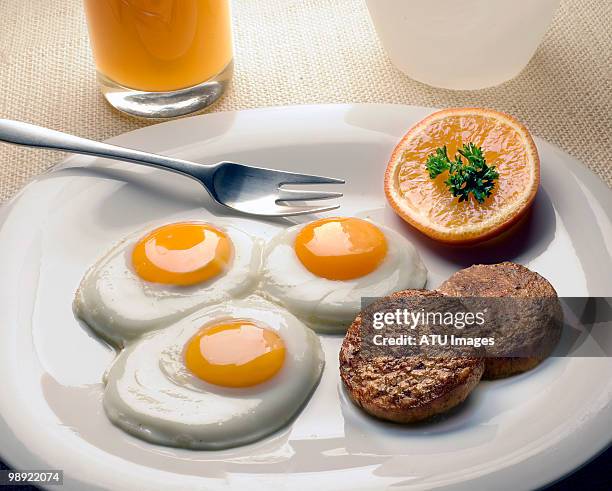 breakfast eggs with sausage - breakfast sausage stock pictures, royalty-free photos & images