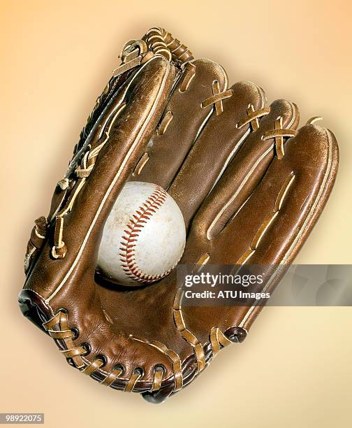 baseball and glove on yellow - baseball glove stockfoto's en -beelden