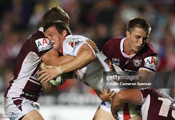 Brett Morris of the Dragons is tackled during the round nine NRL match between the Manly Sea Eagles and the St George Illawarra Dragons at Brookvale...