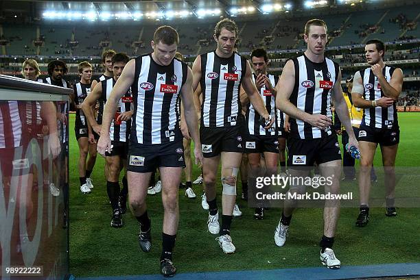 Heath Shaw and Nick Maxwell of the Magpies lead the team off after their win in the round seven AFL match between the Collingwood Magpies and the...