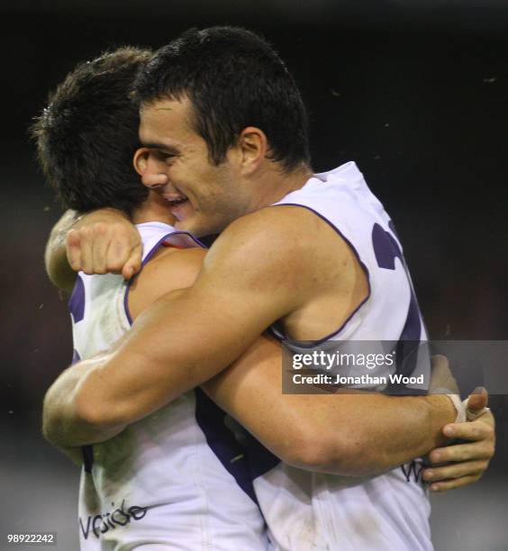 Chris Tarrant and Greg Broughton of the Dockers celebrate victory in the round seven AFL match between the Brisbane Lions and the Fremantle Dockers...