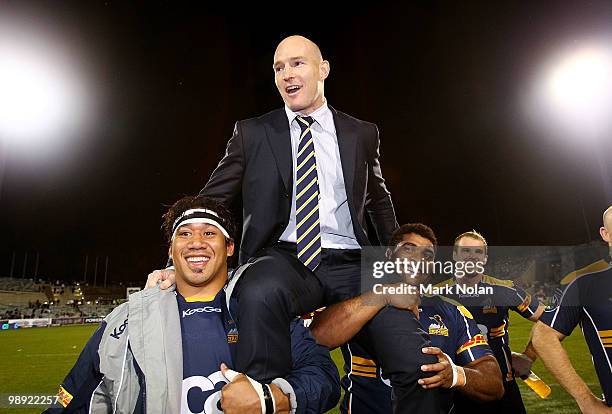 Stirling Mortlock of the Brumbies is chaired from the field after his last home game after the round 13 Super 14 match between the Brumbies and the...