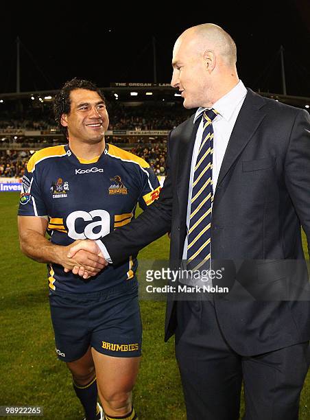 George Smith of the Brumbies shakes the hand of Stirling Mortlock after their last home game after the round 13 Super 14 match between the Brumbies...