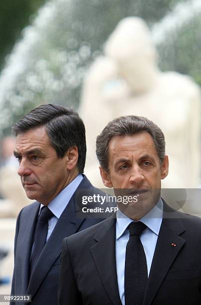 France's President Nicolas Sarkozy with France's Prime Minister Francois Fillon , take part to a ceremony marking the 65th anniversary of the Allied...