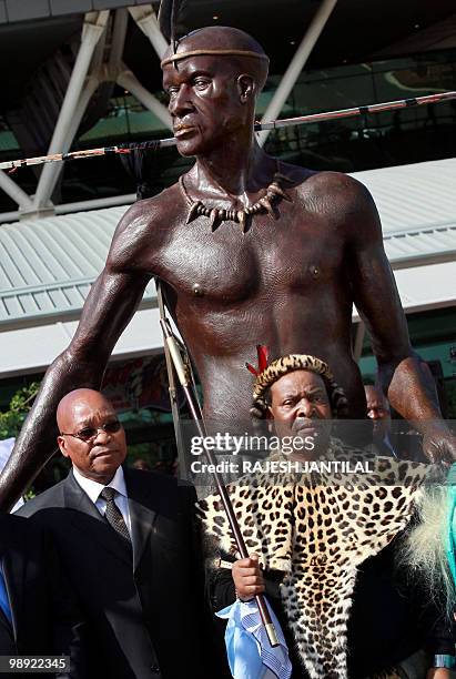 South African President Jacob Zuma and Zulu King Goodwill Zwelithini stand on May 8, 2010 in front of a 3-meter high statue of Zulu King Shaka during...