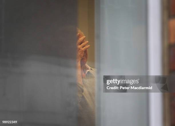 Former Liberal Party leader Paddy Ashdown rubs his head as he stands in Transport House on May 8, 2010 in London, England. Liberal Democrats are...