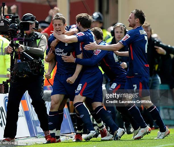 Chris Cohen of Nottingham Forest is mobbed after opening the scoring during the Coca-Cola Championship Playoff Semi Final 1st Leg match at Bloomfield...
