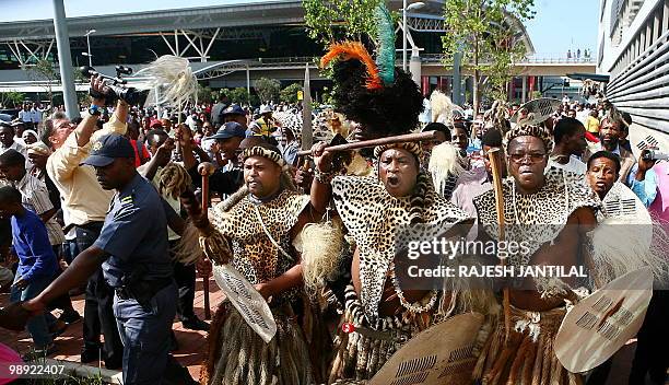 Zulu warriors celebrate on May 8, 2010 the official opening the Central Terminal building of Durban's new King Shaka International Airport and Dube...