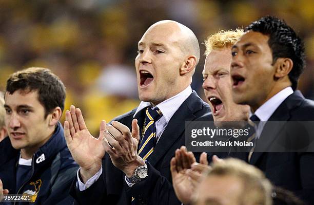 Stirling Mortlock of the Brumbies watches on from the sideline during the round 13 Super 14 match between the Brumbies and the Highlanders at...