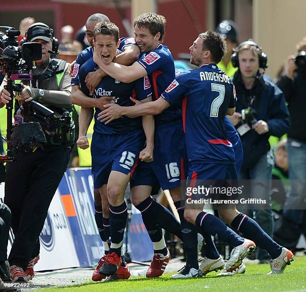 Chris Cohen of Nottingham Forest is mobbed after opening the scoring during the Coca-Cola Championship Playoff Semi Final 1st Leg match at Bloomfield...