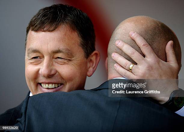 Billy Davies, manager of Nottingham Forest shares a joke with Ian Holloway, manager of Blackpool during the Coca-Cola Championship Playoff Semi Final...