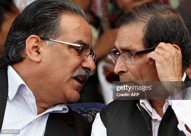 Unified Communist Party of Nepal Chairman Pushpa Kamal Dahal, also known as 'Prachanda' and ideological consultant Mohan Baidya talk during a mass...