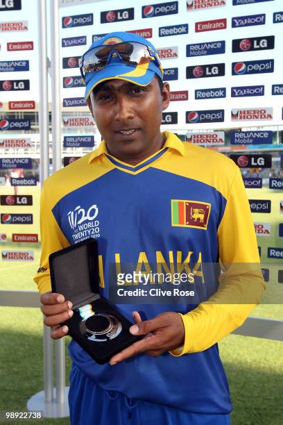 Mahela Jayawardene of Sri Lanka poses with his man of the match award after the ICC World Twenty20 Super Eight match between West Indies and Sri...