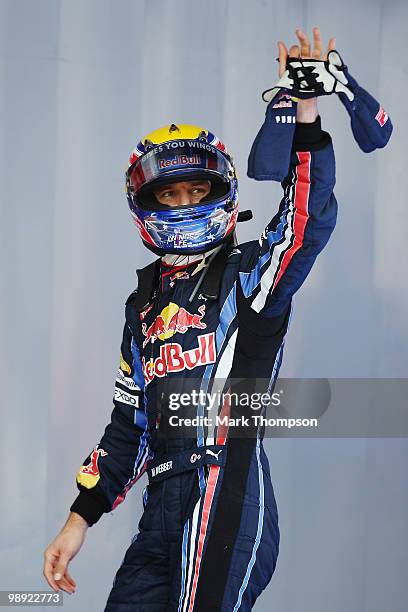 Mark Webber of Australia and Red Bull Racing celebrates in parc ferme after finishing first during qualifying for the Spanish Formula One Grand Prix...