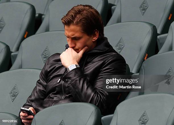 Leverkusen's injured goalkeeper Rene Adler is seen prior to the Bundesliga match between Borussia Moenchengladbach and Bayer Leverkusen at Borussia...