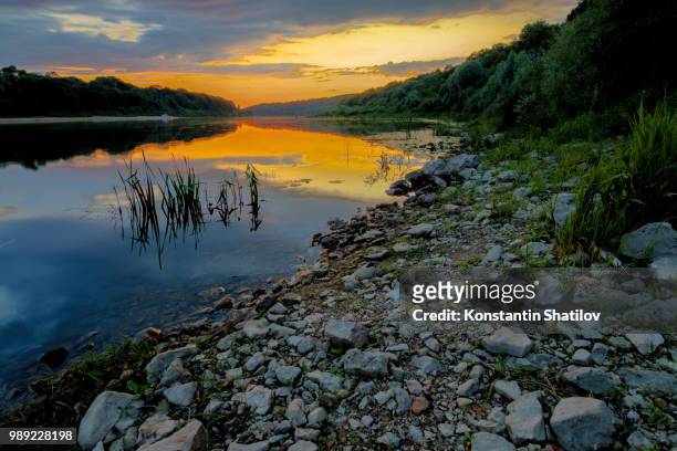 sunset on the oka river - shatilov stock pictures, royalty-free photos & images