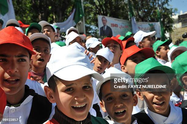 Algerian children sing during the 65th anniversary of the Setif massacre in Setif, eastern Algeria on May 8, 2010.The initial outbreak occurred on...