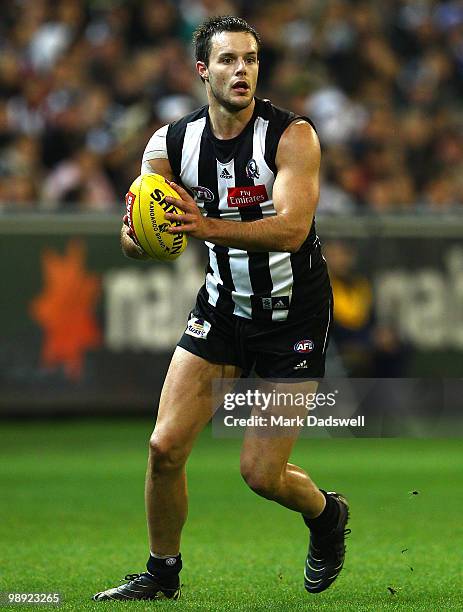 Nathan Brown of the Magpies gathers the ball during the round seven AFL match between the Collingwood Magpies and the North Melboune Kangaroos at...