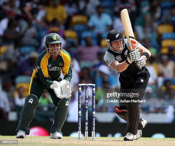 Kamran Akmal looks on as Brendon McCullum of New Zealand hits out during The ICC World Twenty20 Super Eight match between New Zealand and Pakistan...