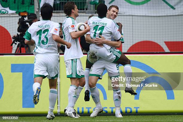 Makoto Hasebe, Christian Gentner, Obafemi Martins and Edin Dzeko of Wolfsburg celebrate during the Bundesliga match between VfL Wolfsburg and...
