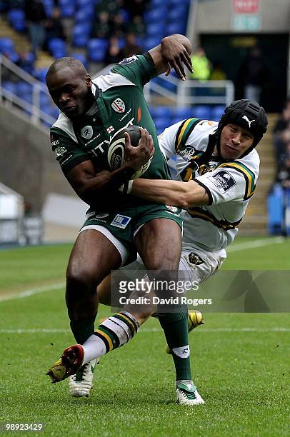 Topsy Ojo of London Irish is tackled by Bruce Reihana during the Guinness Premiership match between London Irish and Northampton Saints at the...