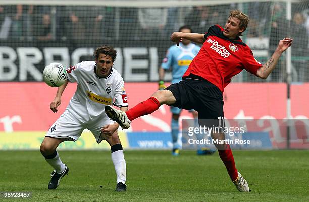 Roel Brouwers of Gladbach and Stefan Kiessling of Leverkusen battle for the ball during the Bundesliga match between Borussia Moenchengladbach and...