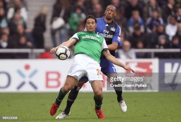 Jerome Boateng of Hamburg and Claudio Pizarro of Bremen battle for the ball during the Bundesliga match between SV Werder Bremen and Hamburger SV at...