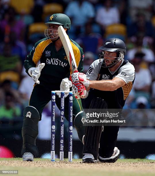 Kamran Akmal looks on as Daniel Vettori of New Zealand hits out during The ICC World Twenty20 Super Eight match between New Zealand and Pakistan...