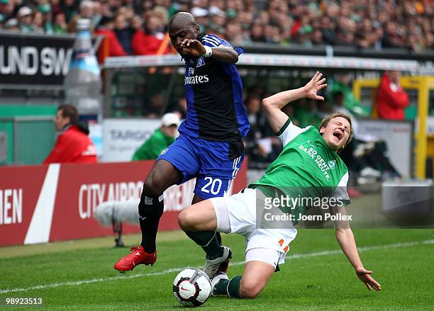 Guy Demel of Hamburg and Philipp Bargfrede of Bremen battle for the ball during the Bundesliga match between SV Werder Bremen and Hamburger SV at...