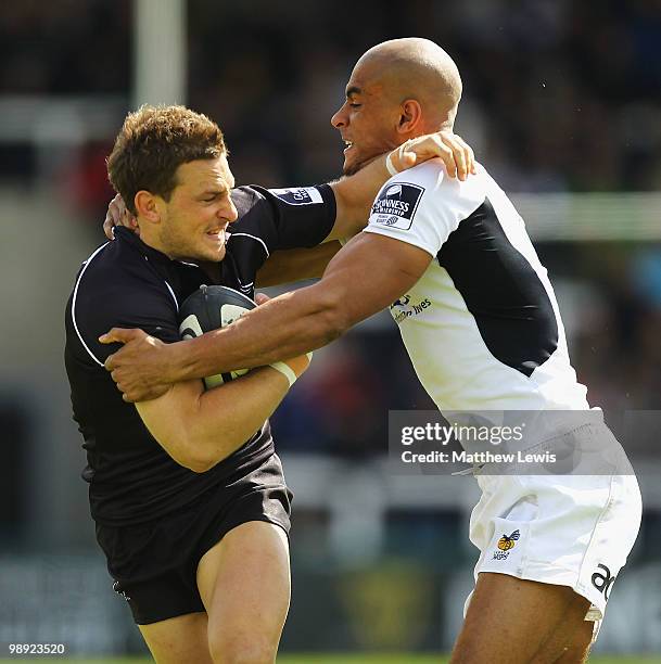 Jimmy Gopperth of Newcastle hands off Tom Varndell of Wasps during the Guinness Premiership match between Newcastle Falcons and London Wasps at...