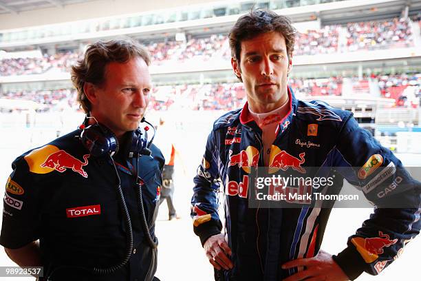 Mark Webber of Australia and Red Bull Racing talks with his Team Principal Christian Horner as he prepares to drive during qualifying for the Spanish...