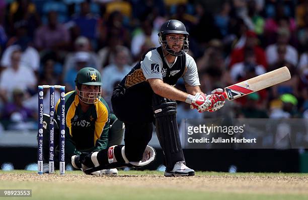 Kamran Akmal looks on as Daniel Vettori of New Zealand scores runs during The ICC World Twenty20 Super Eight match between New Zealand and Pakistan...