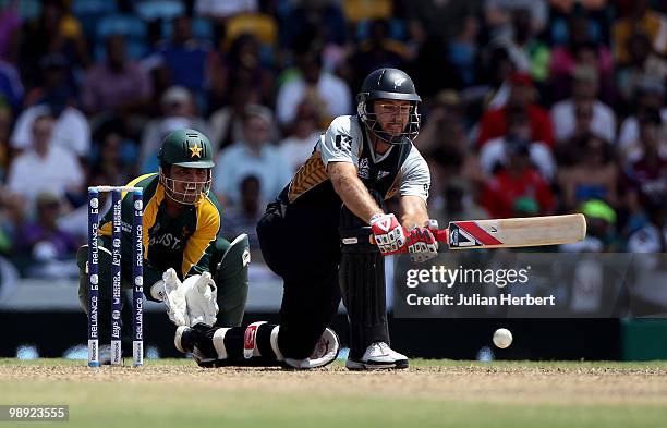 Kamran Akmal looks on as Daniel Vettori of New Zealand scores runs during The ICC World Twenty20 Super Eight match between New Zealand and Pakistan...