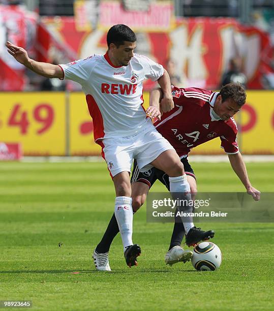 Albert Bunjaku of Nuernberg fights for the ball with Taner Yalcin of Koeln during the Bundesliga match between 1. FC Nuernberg and 1. FC Koeln at...