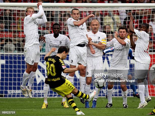 Felix Bastians, Mohamadou Idrissou, Pavel Krmas, Ivica Banovic, Stefan Reisinger, Stefan Reisinger and Cedrick Makiadi of Freiburg jump as Tamas...