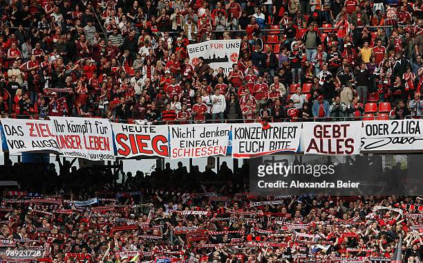 Fans of Nuernberg support their team during the Bundesliga match between 1. FC Nuernberg and 1. FC Koeln at Easy Credit Stadium on May 8, 2010 in...
