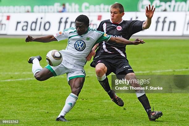 Obafemi Martins of Wolfsburg and Sebastian Jung of Frankfurt fight for the ball during the Bundesliga match between VfL Wolfsburg and Eintracht...
