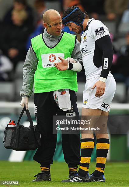 Danny Cipriani of Wasps looks on, as he receives treatment to his hand during the Guinness Premiership match between Newcastle Falcons and London...