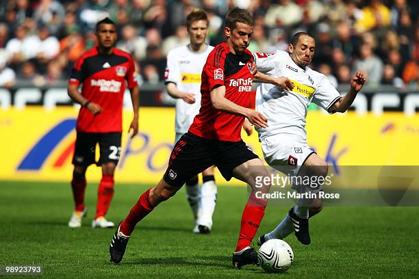Oliver Neuville of Gladbach and Lars Bender of Leverkusen battle for the ball during the Bundesliga match between Borussia Moenchengladbach and Bayer...
