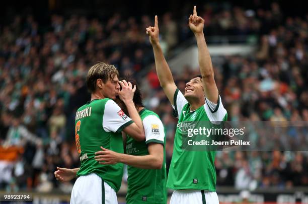 Claudio Pizarro of Bremen celebrates after scoring his team's first goal during the Bundesliga match between SV Werder Bremen and Hamburger SV at...