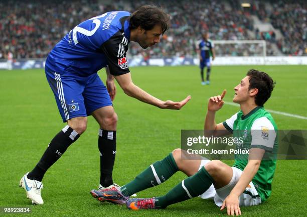 Ruud van Nistelrooy of Hamburg and Mesut Oezil of Bremen speak during the Bundesliga match between SV Werder Bremen and Hamburger SV at Weser Stadium...