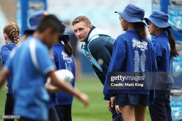 Tariq Sims takes part in a juniors coaching clinic during the New South Wales Blues State of Origin Team Announcement at ANZ Stadium on July 2, 2018...