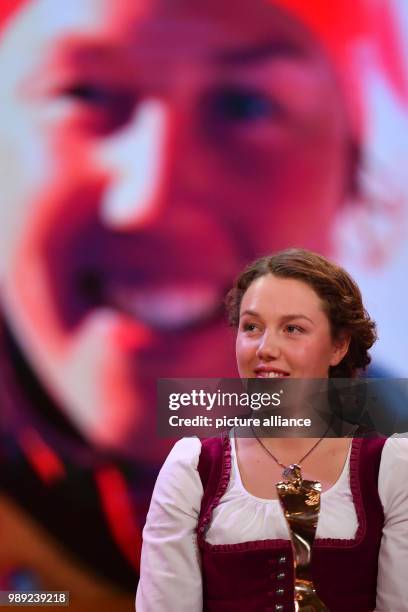 Biathlete Laura Dahlmeier stands onstage during the election to "Athlete of the year" at the Kurhaus in Baden-Baden, Germany, 17 December 2017....