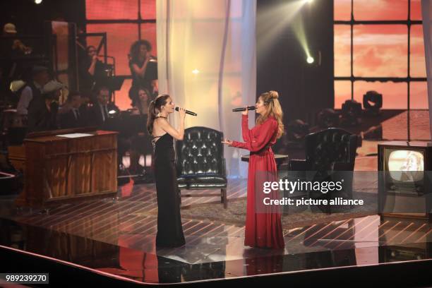 Coach Yvonne Catterfeld and candidate BB Thomaz during the finale of the ProSiebenSat.1 show "The Voice of Germany" in Berlin, Germany, 17 December...